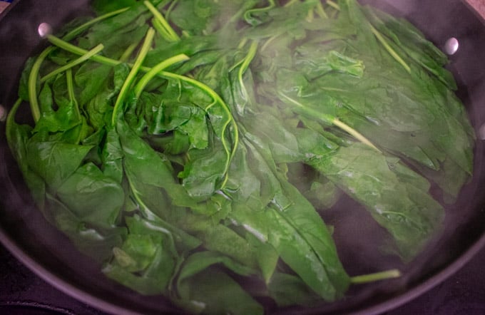 spinach boiling in pot 