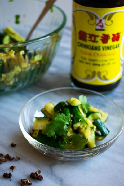 smashed cucumber salad with chinese black vinegar bottle in the back