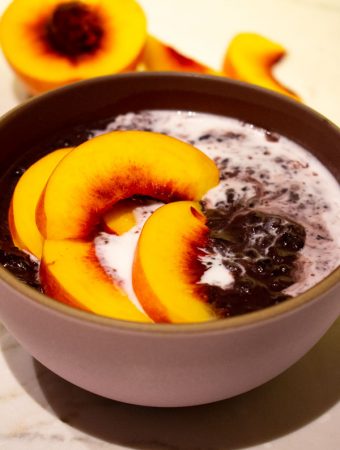 superfood black rice pudding with peaches and coconut milk