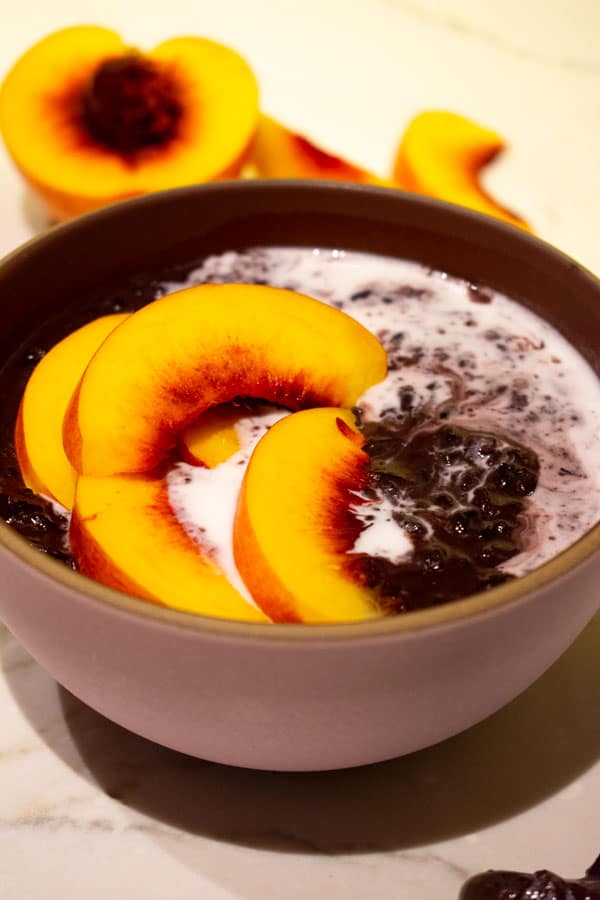 superfood black rice pudding with peaches and coconut milk