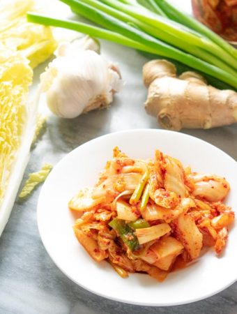 kimchi on white plate with vegetables