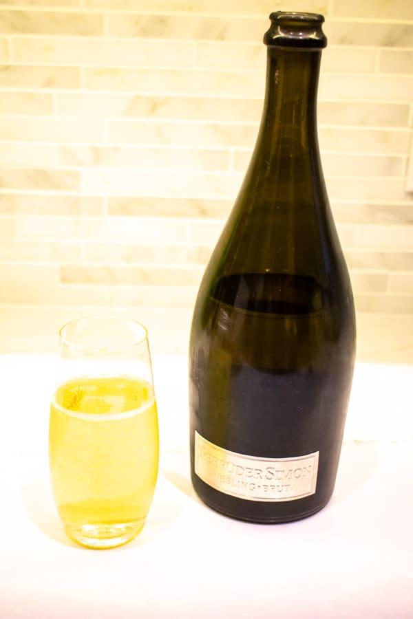 sparkling riesling bottle and glass of wine