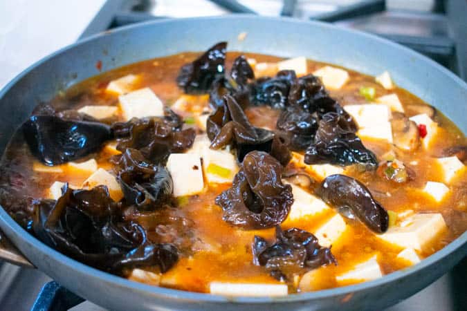 Easy Vegan Mapo Tofu simmering in pan