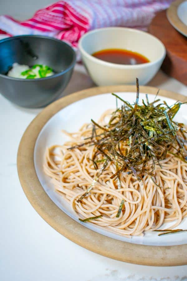 soba noodles on plate with dipping sauce