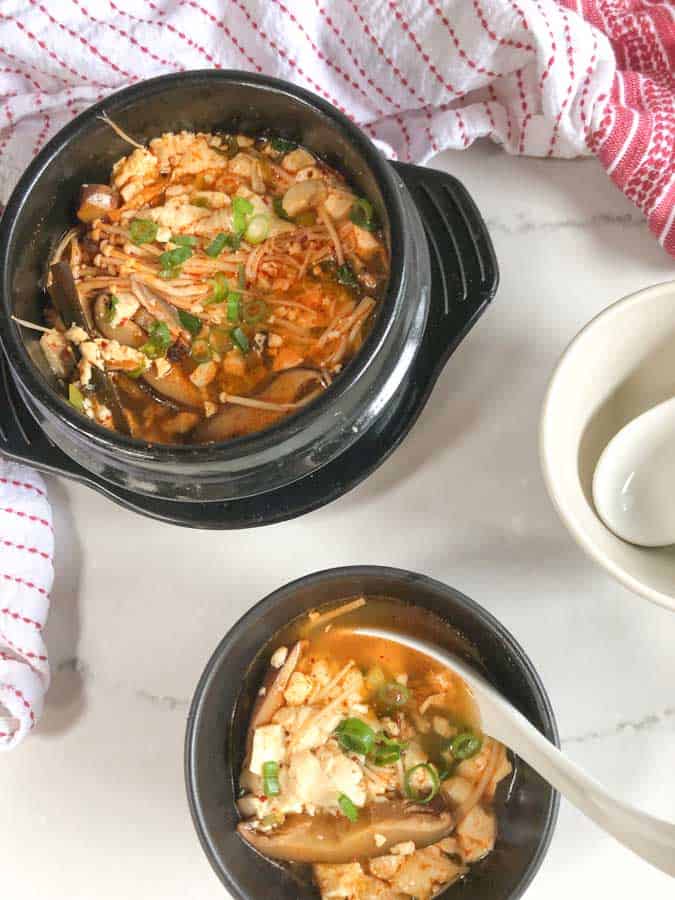 Vegan Korean Soft Tofu Soup for Soondubu in black pot