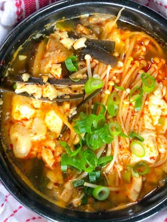 Vegan Korean Soft Tofu Soup or Soondubu Jigae in black pot