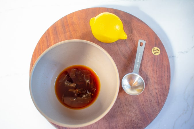 Ponzu sauce for oysters in a bowl with lemon