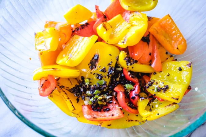 Mixed bell peppers in a glass bowl with black bean sauce