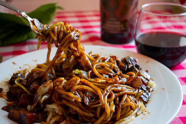 Fork twirling vegetarian black bean sauce noodles - Korean