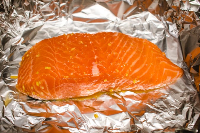 Raw salmon filet on foil for Japanese marinated salmon