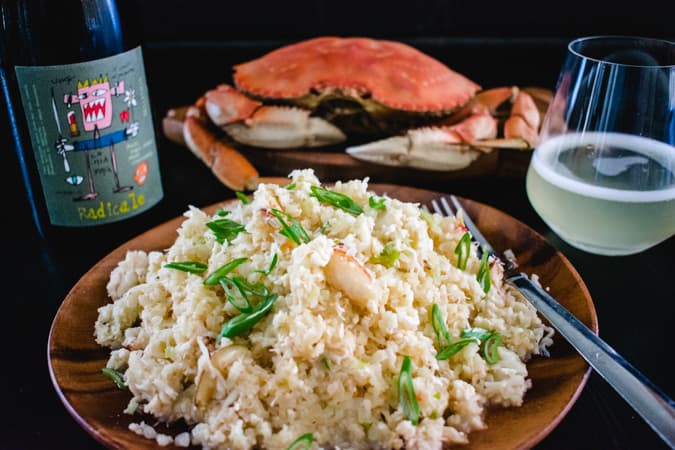 cauliflower crab fried rice with bottle and glass of prosecco
