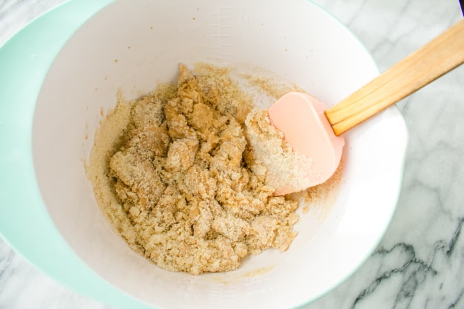 chinese almond cookie mix in a bowl with pink spatula