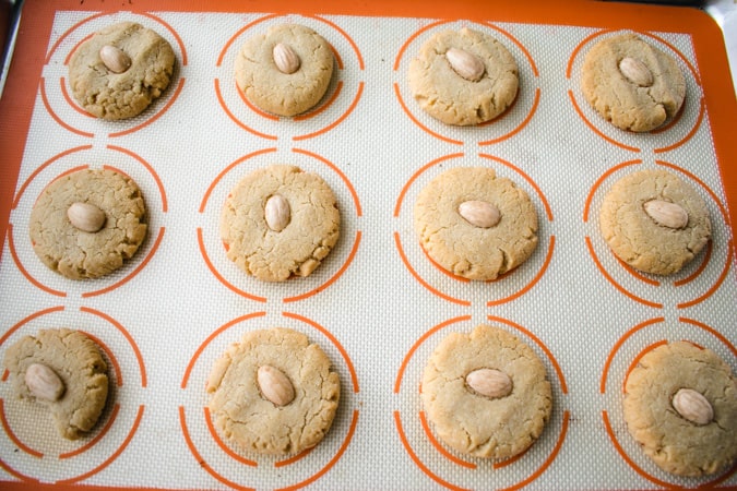 baked chewy chinese almond cookies on silicone baking sheet