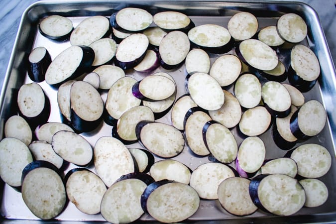 Slices of Chinese eggplant on sheet pan