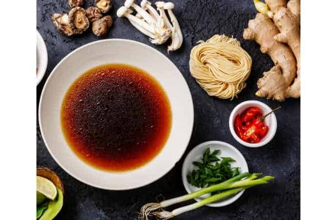 ramen noodle ingredients on a black background