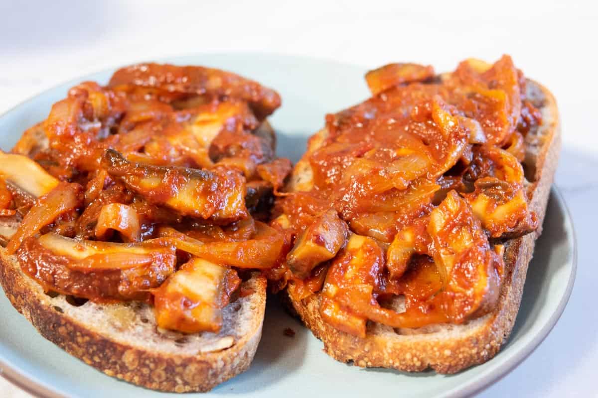 Mushrooms, onion and tomato sauce on toast