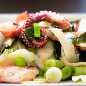 Hawaiian octopus poke on a white plate