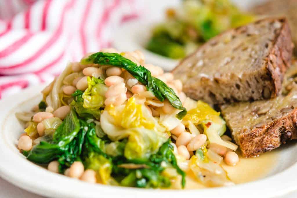 close up shot of vegan beans and greens with toast