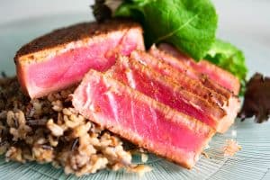 sliced blackened tuna on wild rice