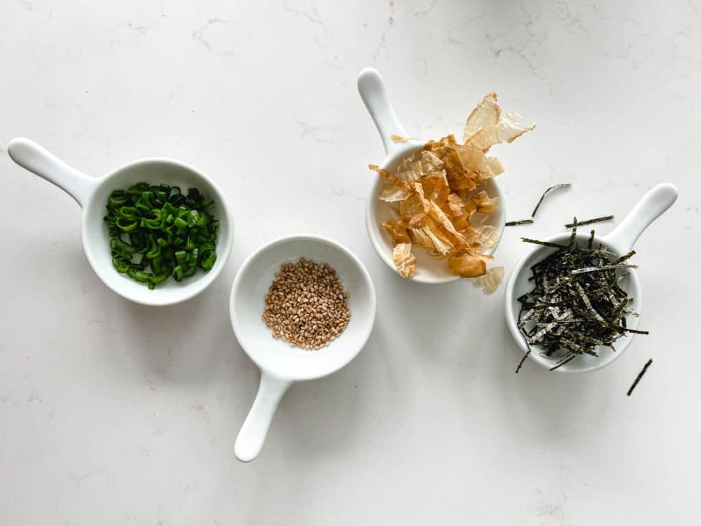 garnishes for tuna kimchi fried rice in 4 mini white pan dishes