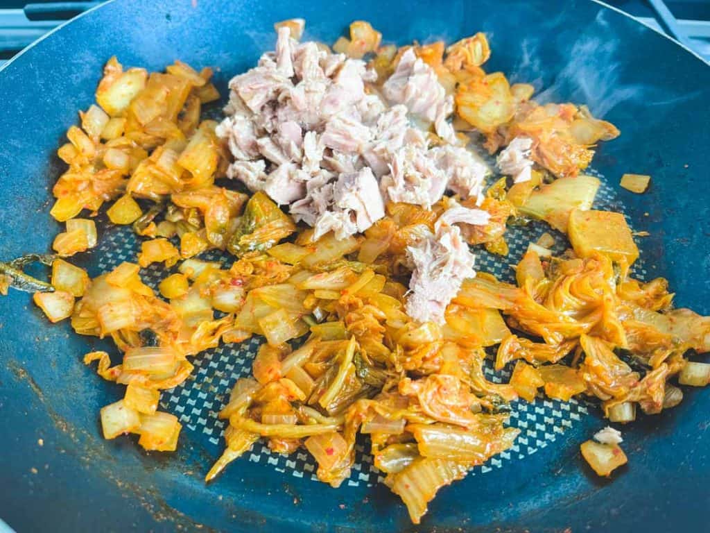tuna and sauteed kimchi in a nonstick skillet