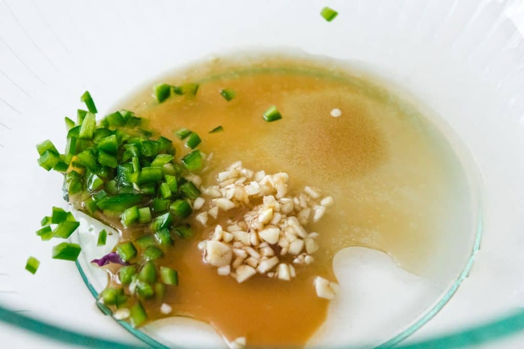 ingredients for Mango Salmon salad dressing in a glass bowl