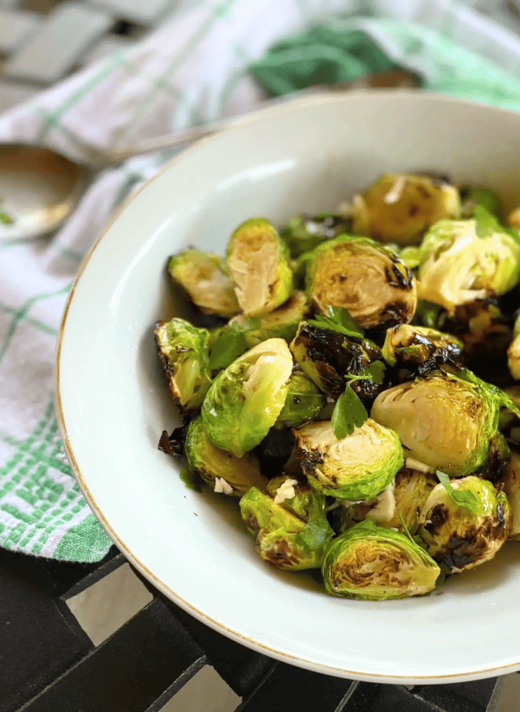 grilled brussel sprouts in a white bowl