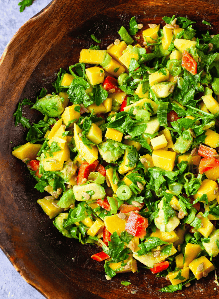 mango avocado salad in a brown bowl