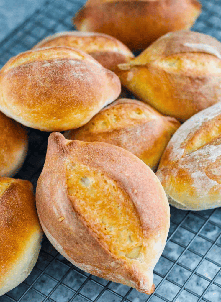 bolivian bread rolls on a wire cooling rack