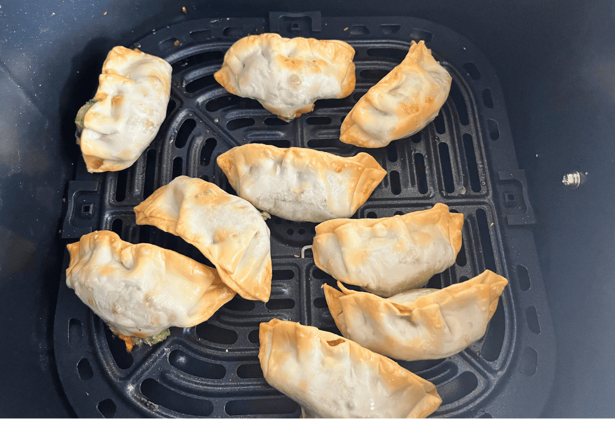 9 cooked Trader Joe's gyoza in an air fryer basket