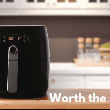 black air fryer on a kitchen countertop with the words "worth the $$?"