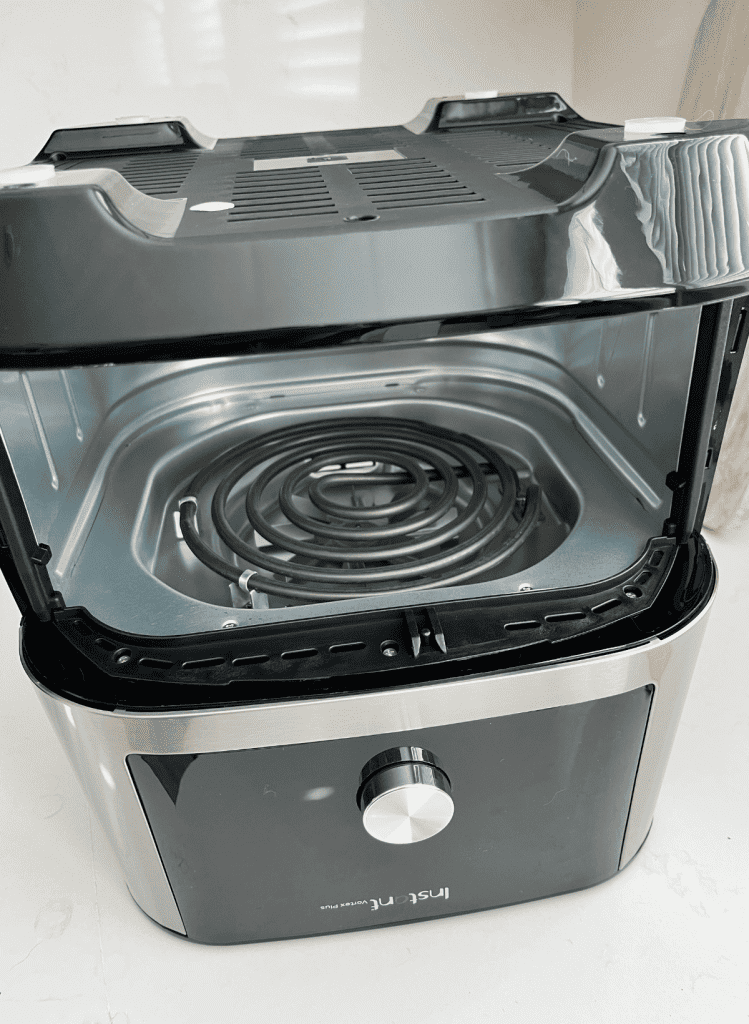 Instant Pot Vortex Air Fryer turned upside down with with electric coils exposed