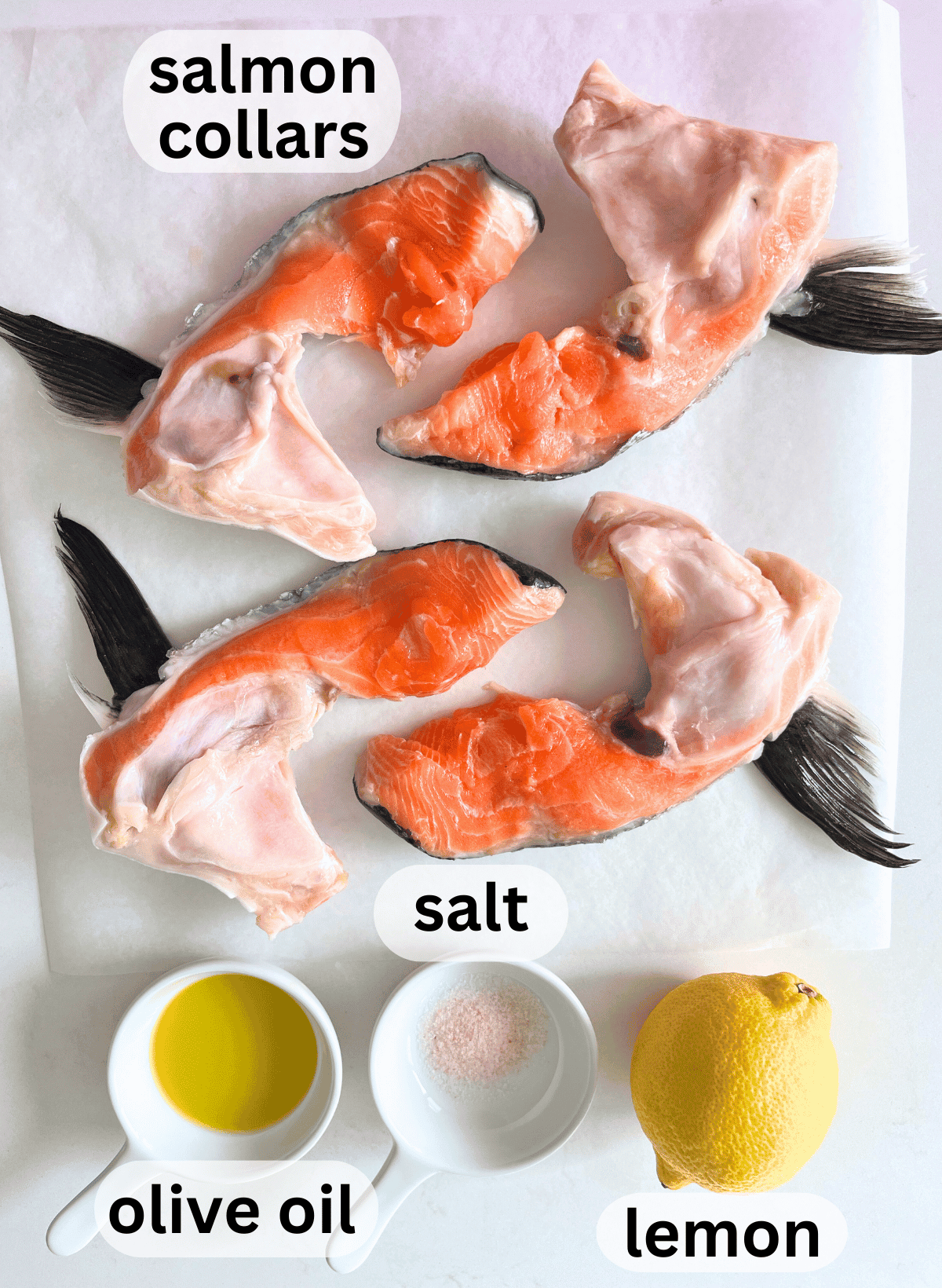 Ingredients for baked salmon collars on a white background