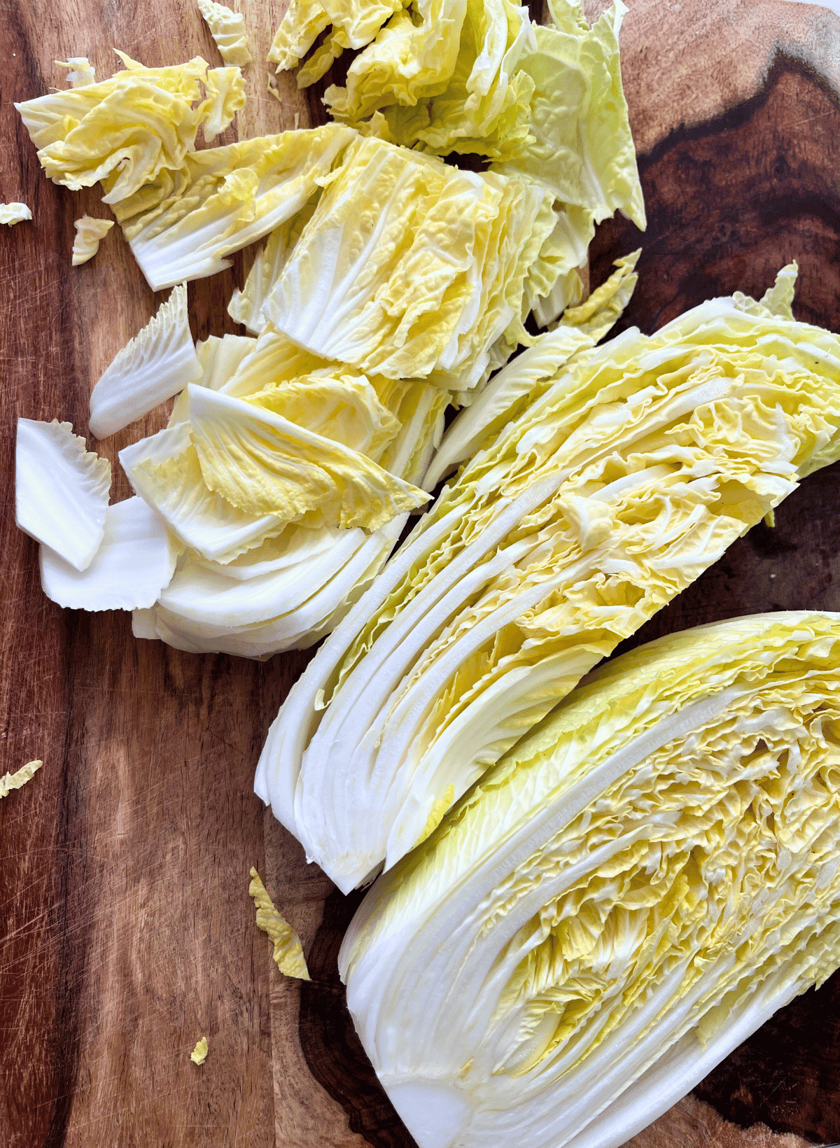 napa cabbage chopped on a wooden cutting board