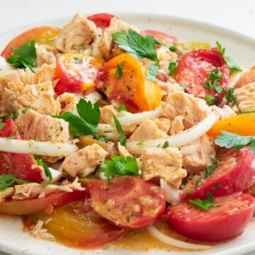 tuna tomato salad on a round white plate