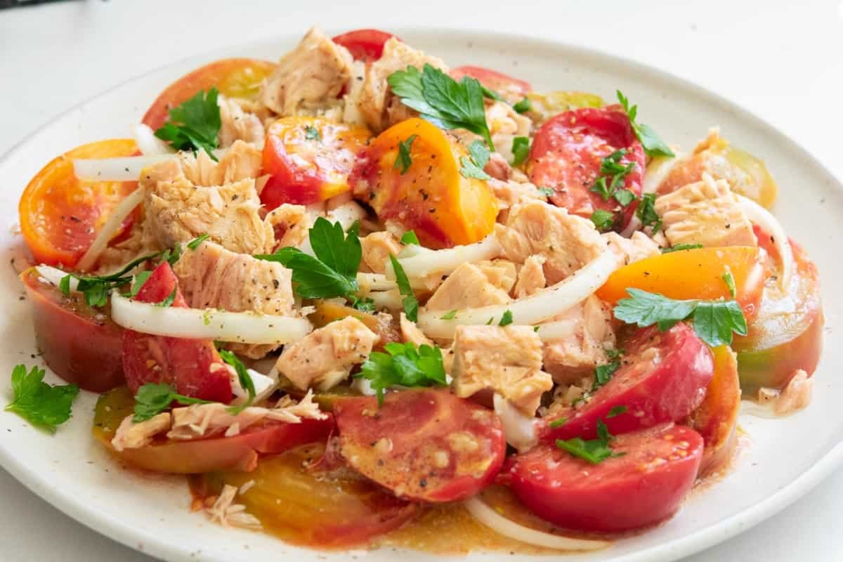 tuna tomato salad on a round white plate